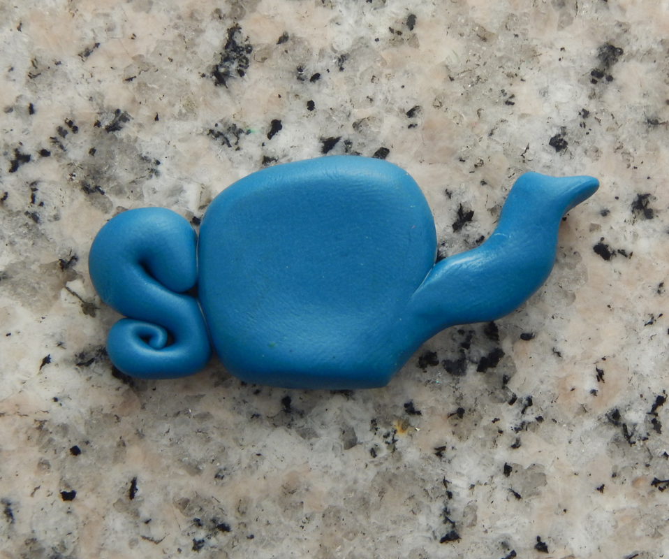 A blue polymer clay teapot made from the three pieces in previous picture. 